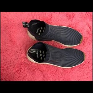 Adidas NMDs without laces (slip ons) great for working out or streetwear.